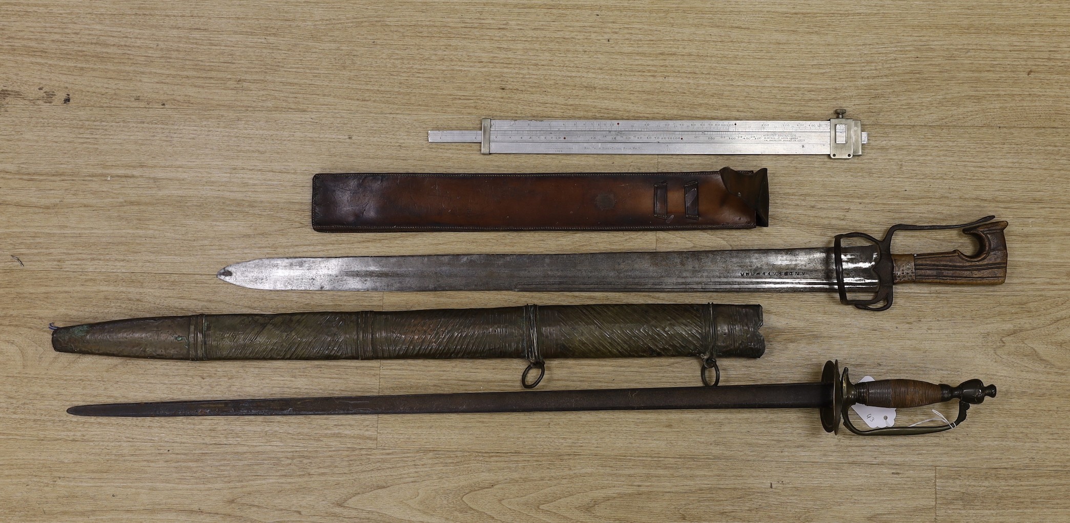 A Moroccan nimcha sword with associated Andrea Ferrara (Scottish) blade and a scabbard together with a court sword and an Aston & Mander Ltd. Mk VI military rule in leather case